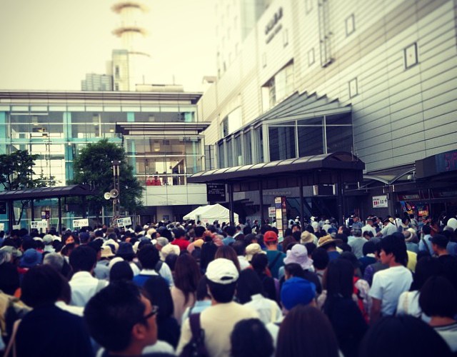 waiting in the crowd for trains
