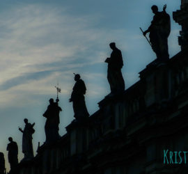 Silhouettes of statues of saints on the Katolische Hofkiche in Dresden, Germany.